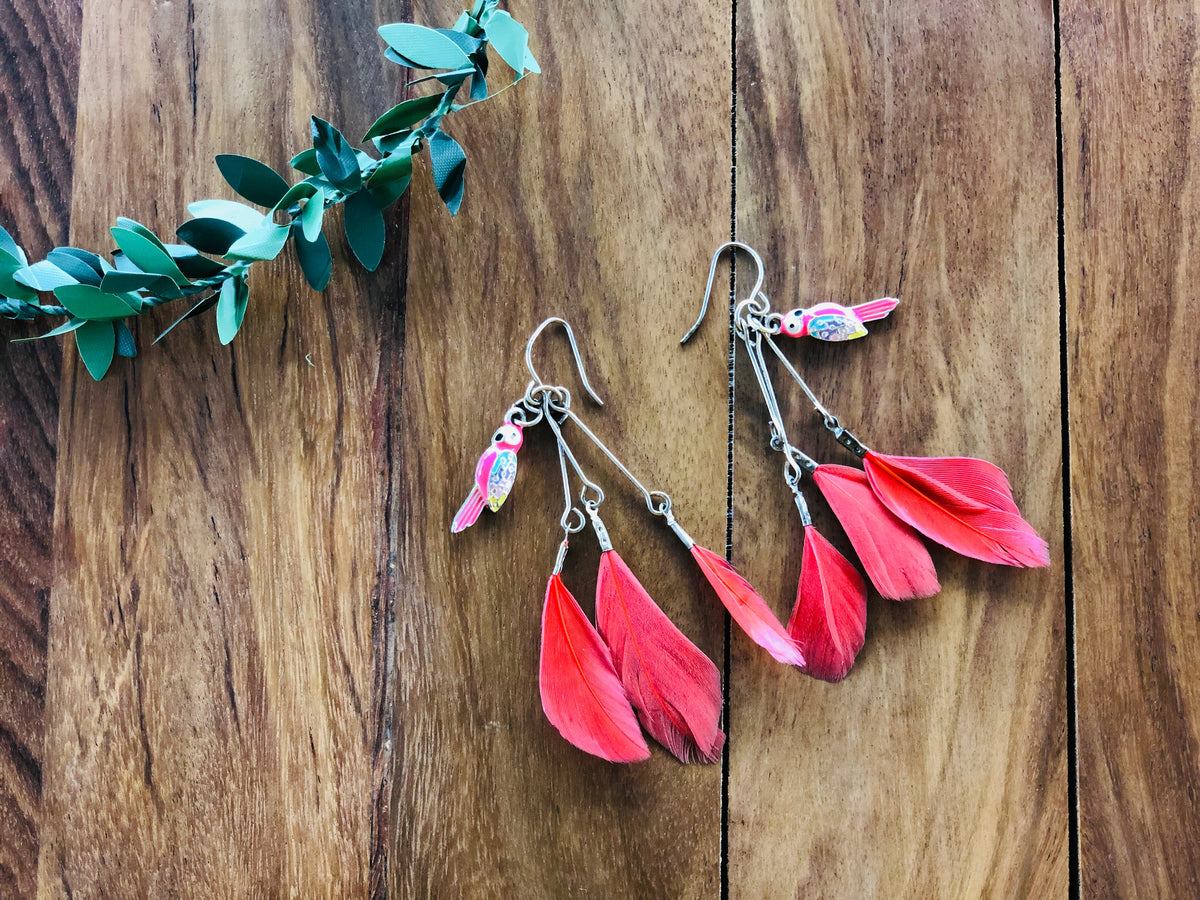 Red feathered earrings